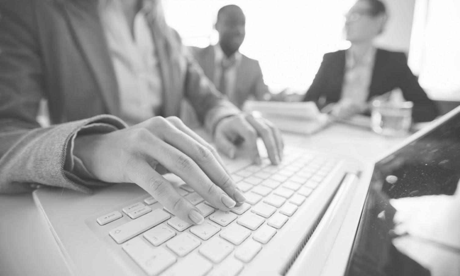 Modern business workspace with financial documents and technology